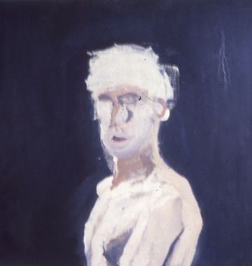 Portrait of a white man against a blue background.
