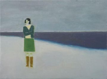 Figure of a woman in green by the seashore.