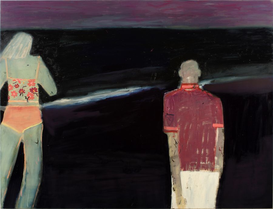 Two figures on the seashore at night.