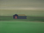 A barn in a green field