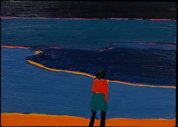 A figure looking out at a blue sea at night.